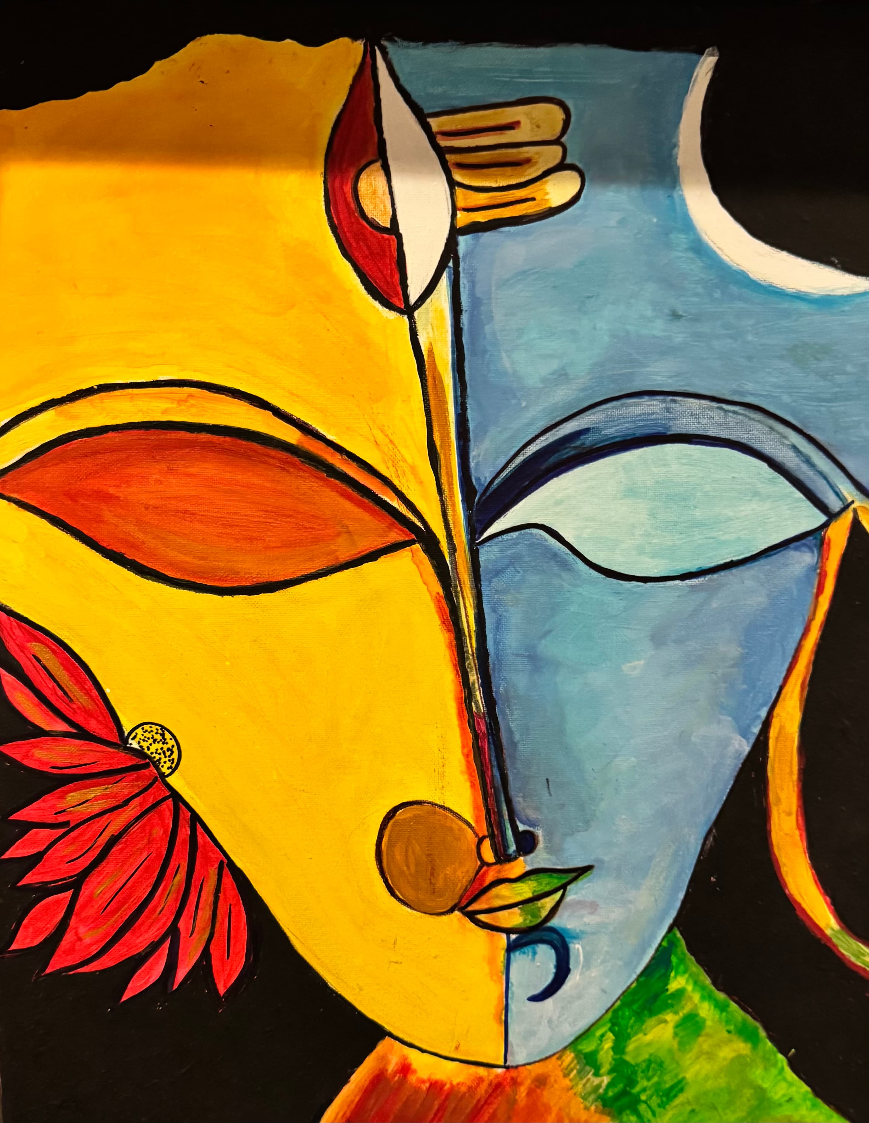 A young student painting with focus and joy during class